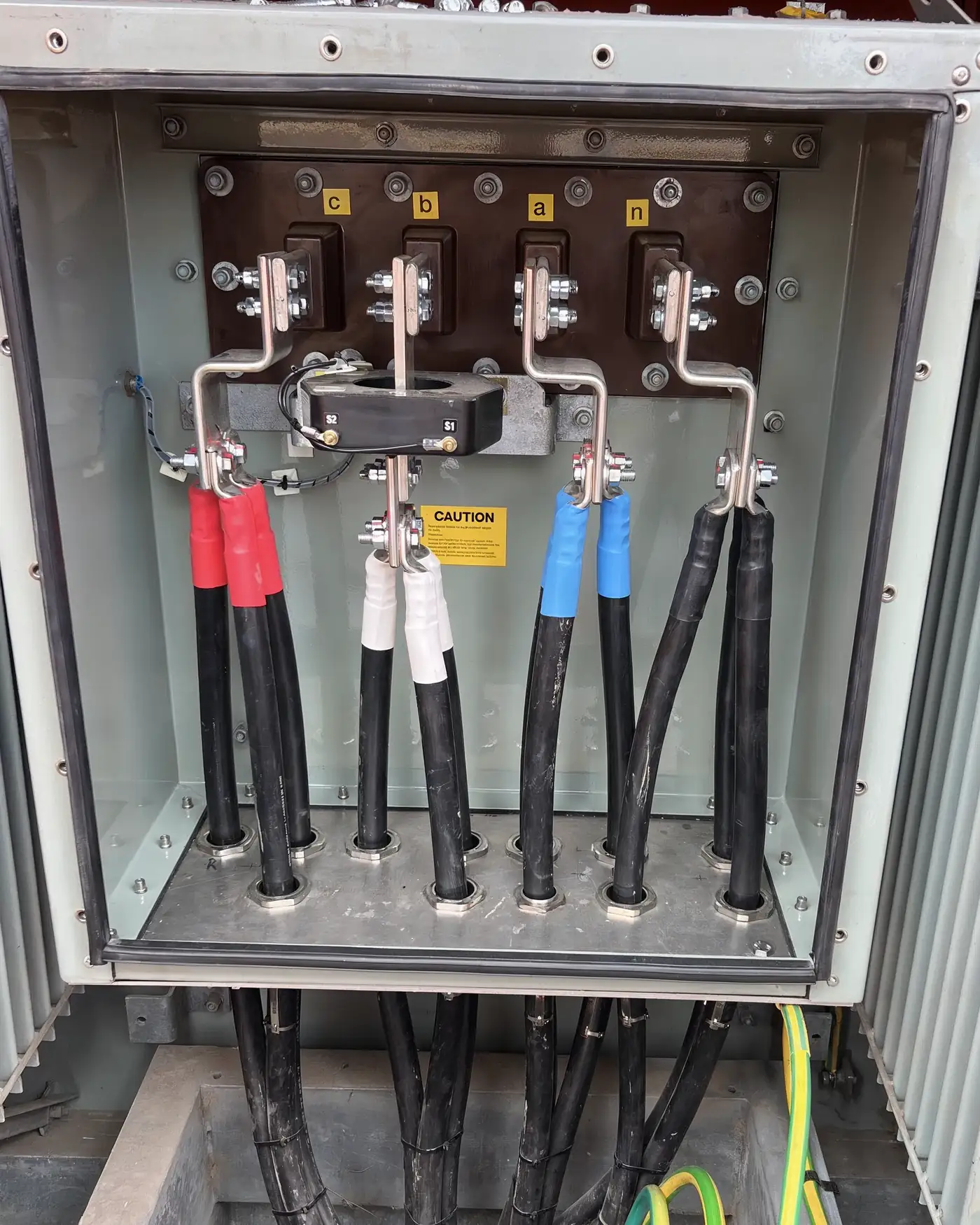 Low voltage cable box on a transformer with the cables landed and the current transformer fitted