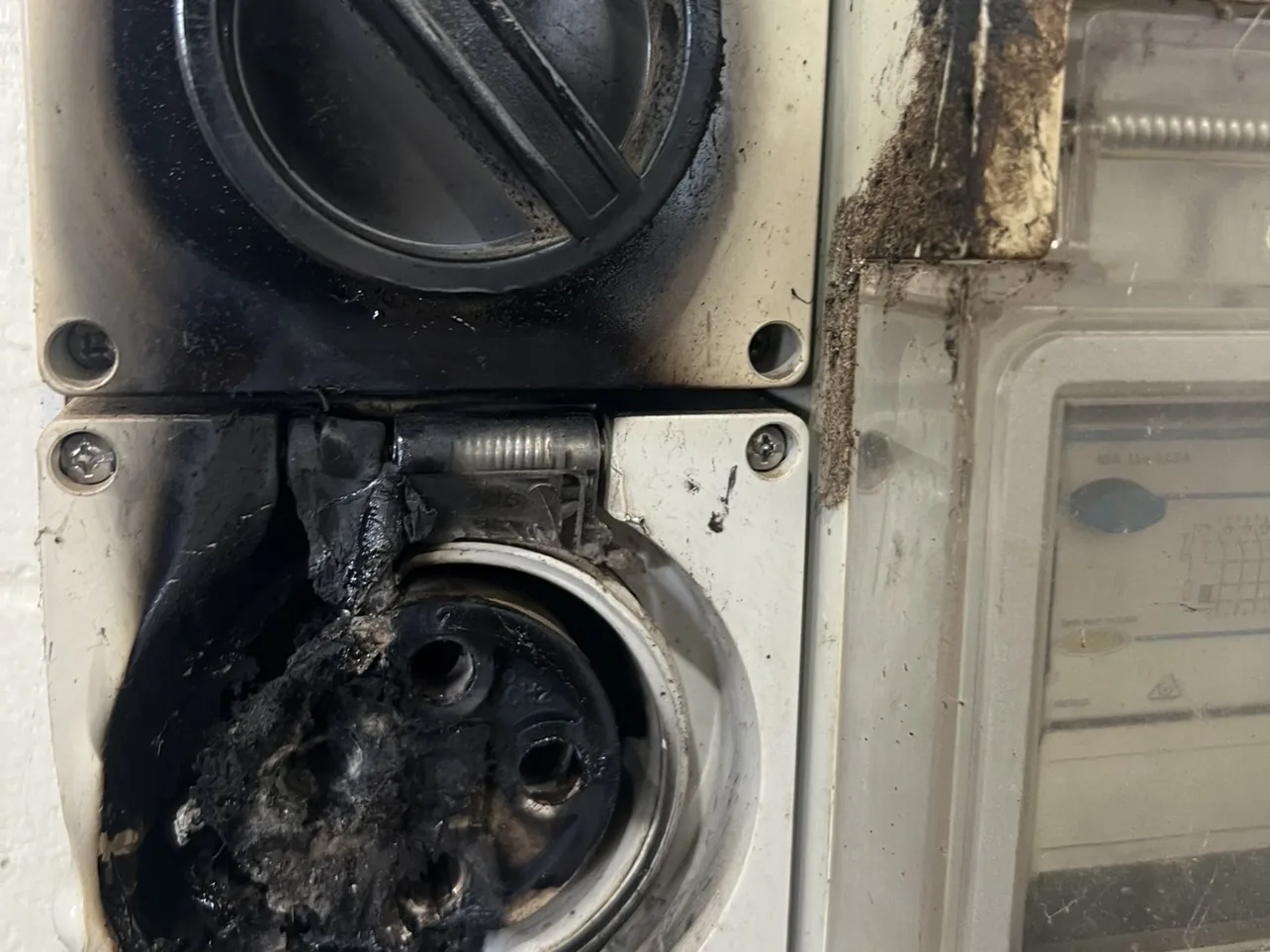 Burnt industrial isolator switch and socket after an electrical fault