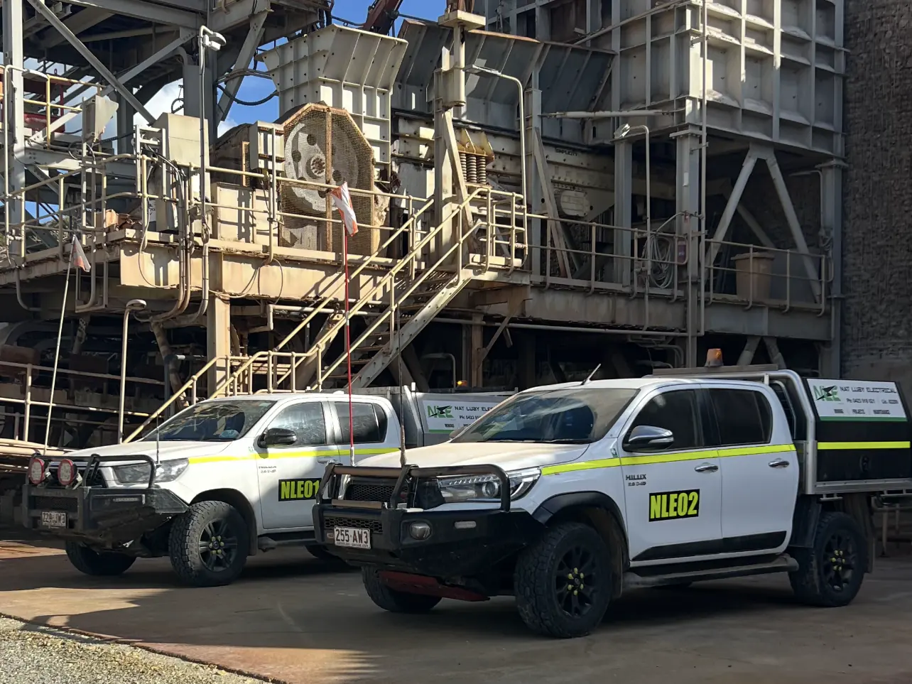 Nat Luby Electrical service utes staged beneath a mine site crushing and screening plant